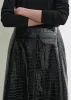 Croco-embossed skirt black sold by Toteme