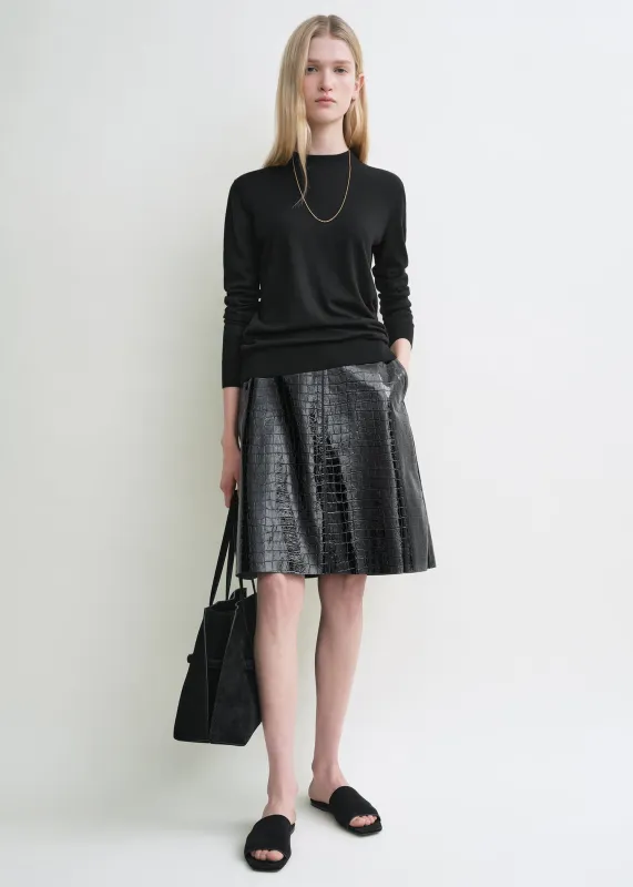 Croco-embossed skirt black sold by Toteme