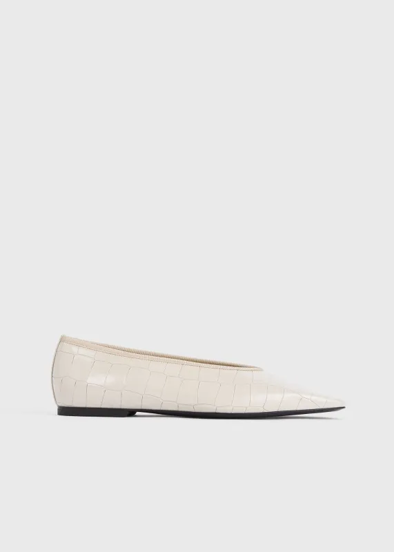 Minimalist croco-embossed ballerinas oyster sold by Toteme