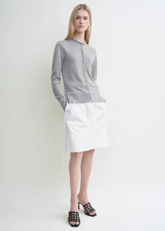 Fine knit cardigan grey sold by Toteme