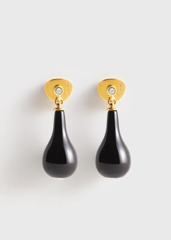 Onyx drops black/gold sold by Toteme