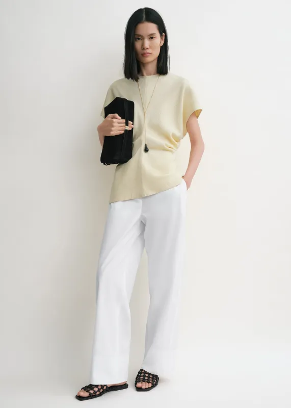 Slouch waist basketweave top straw sold by Toteme