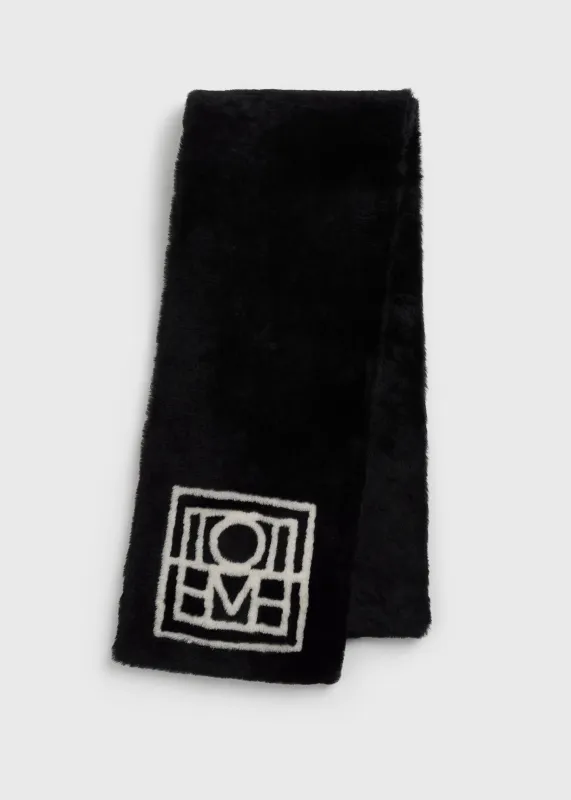 Monogram shearling scarf black sold by Toteme