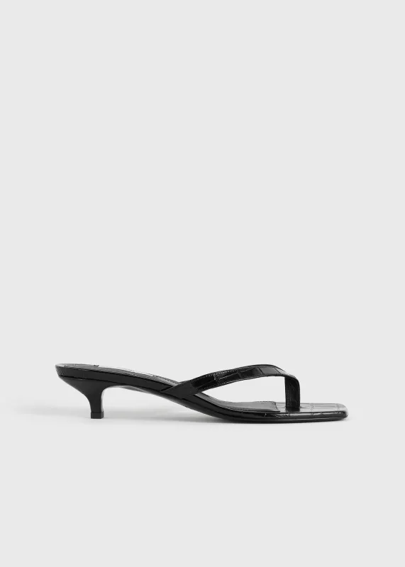 Croco-embossed heeled flip flops black sold by Toteme