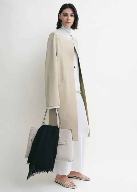 Collarless suede coat peanut sold by Toteme