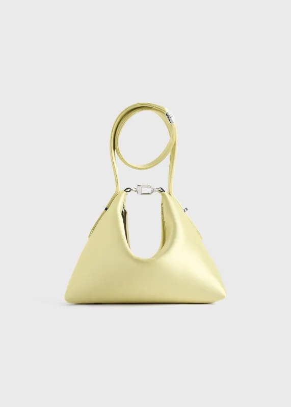 Bevel satin wristlet pale yellow sold by Toteme