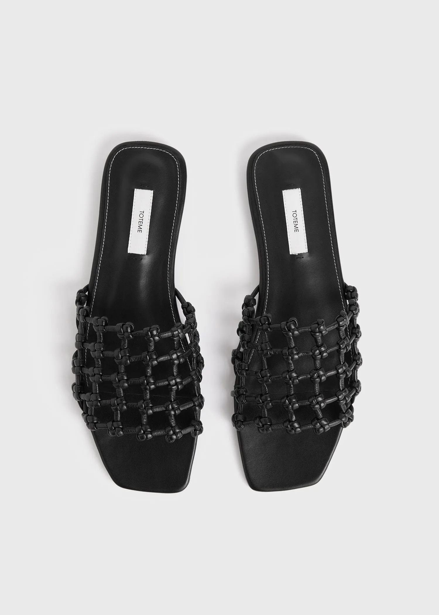 Braided-leather bandeau slides black sold by Toteme product image thumbnail 4