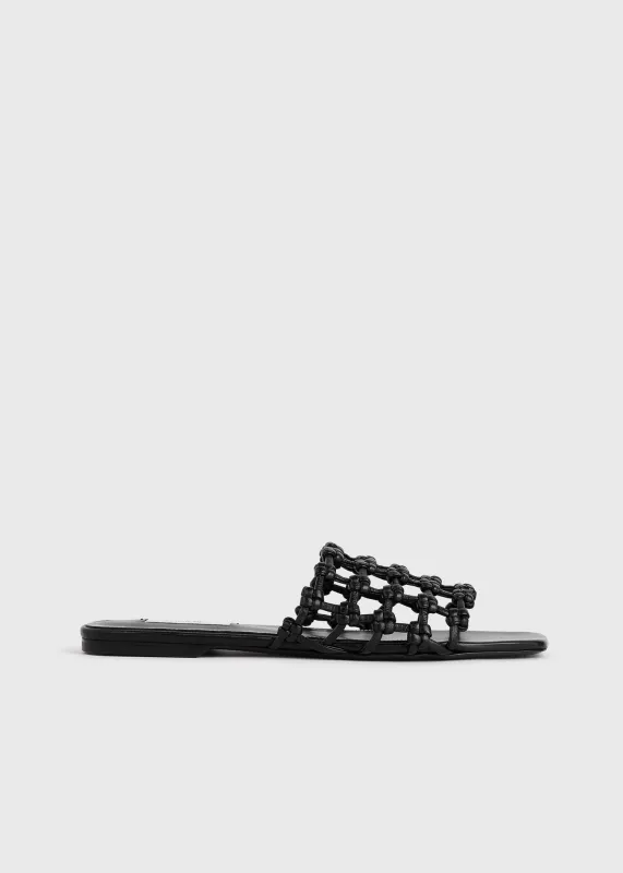 Braided-leather bandeau slides black sold by Toteme