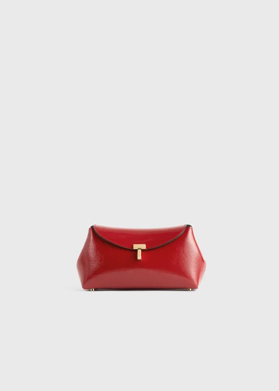 Mini T-lock naplack clutch red sold by Toteme