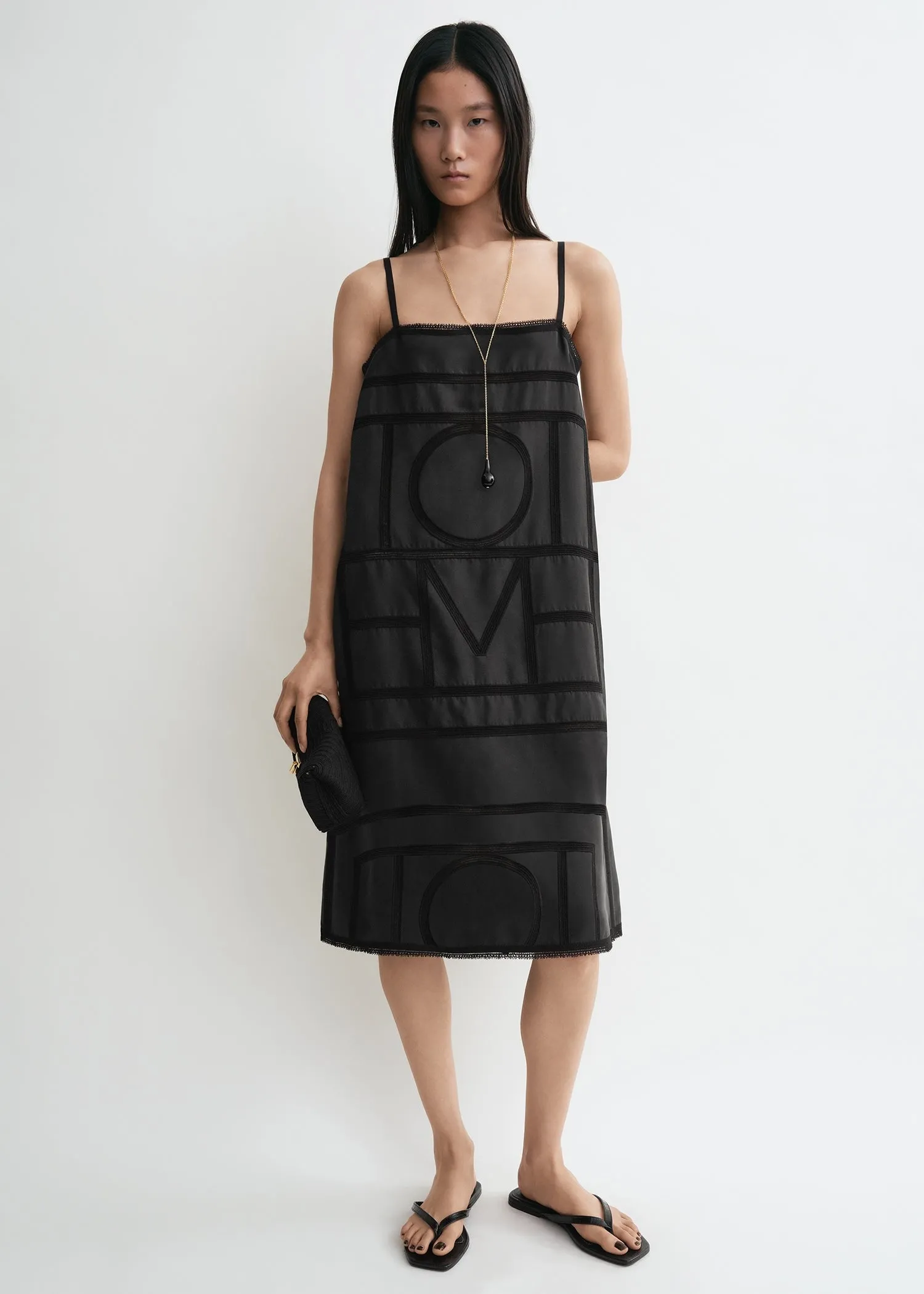 Monogram silk dress washed black sold by Toteme