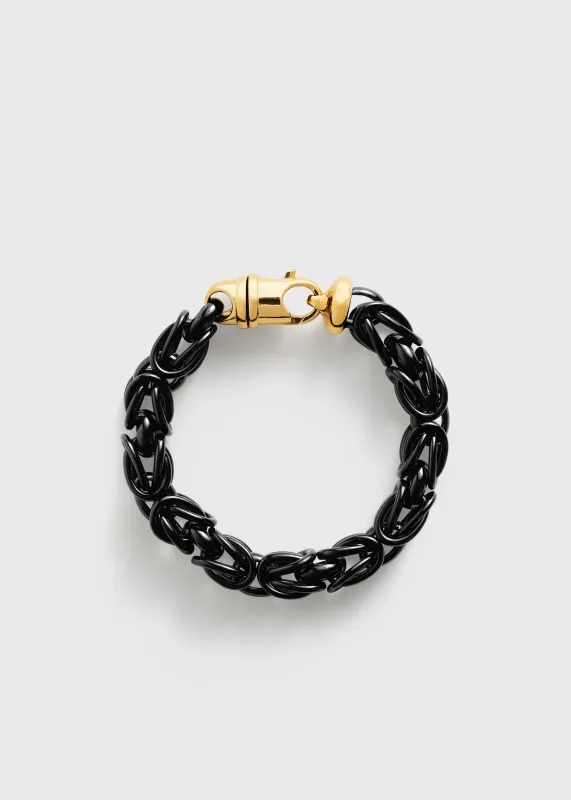 Byzantine bracelet black/gold sold by Toteme