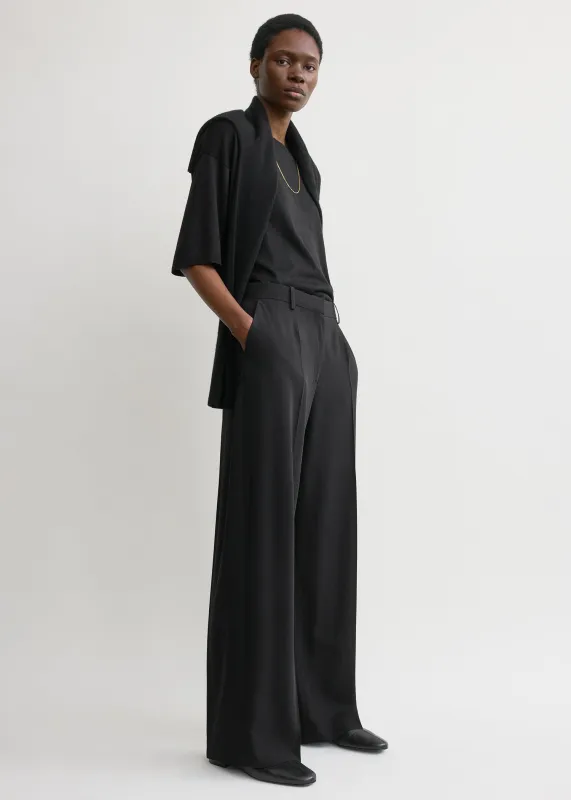 Wide fluid trousers black sold by Toteme