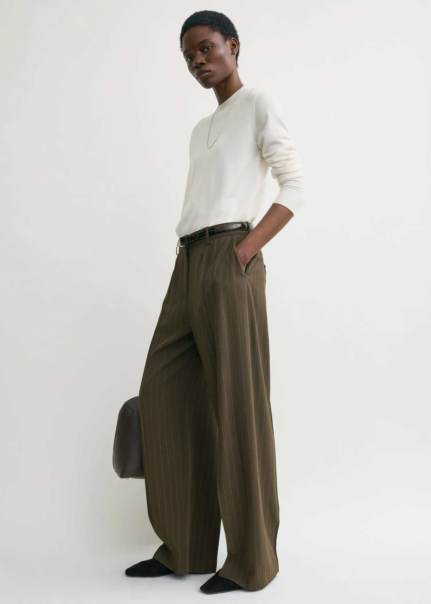 Wide pinstriped trousers pepper sold by Toteme