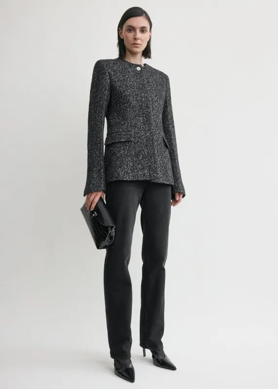 Collarless cinched jacket black/white sold by Toteme