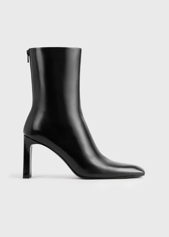 Bar glossy leather boots black sold by Toteme