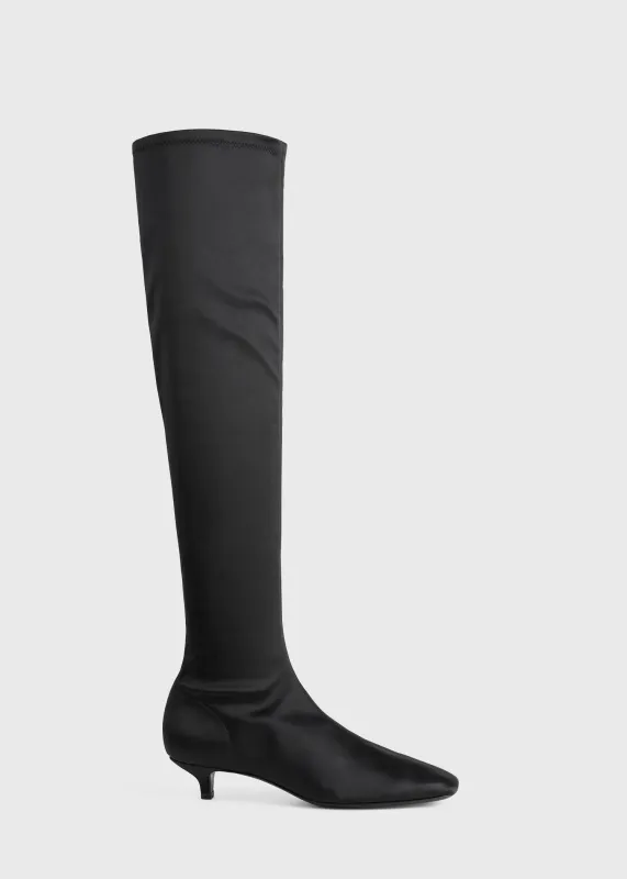 Satin knee-high boots black sold by Toteme