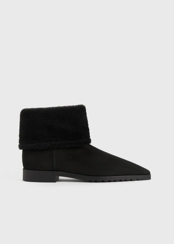 Fold-down shearling boots black sold by Toteme