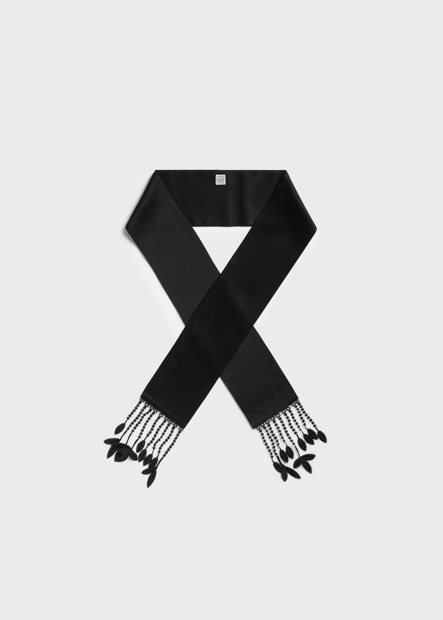 Guipure lace tuxedo scarf black sold by Toteme