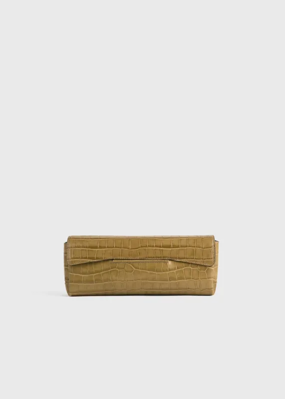 Soft croco-embossed t-clutch biscuit sold by Toteme