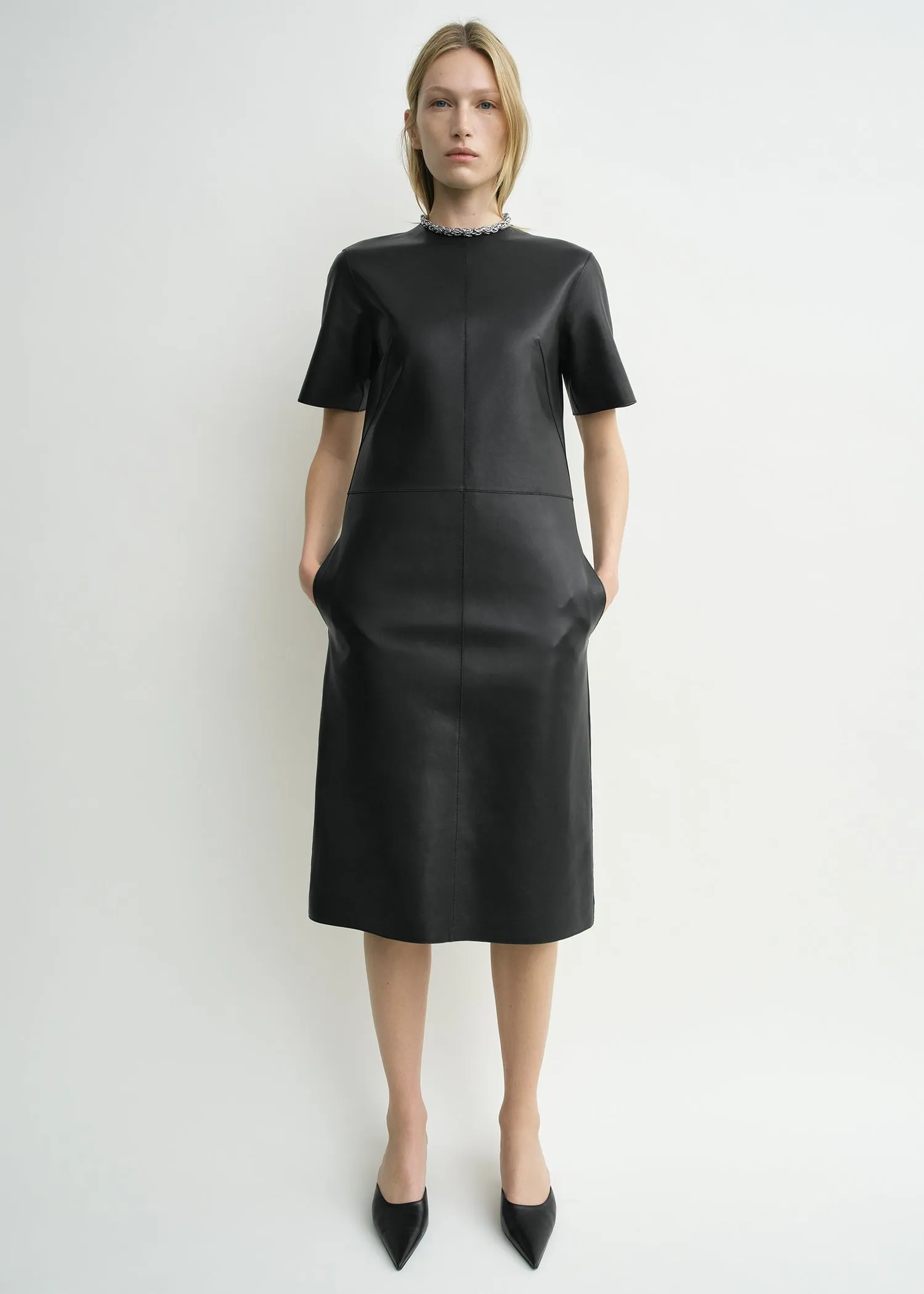 Leather tee dress black sold by Toteme