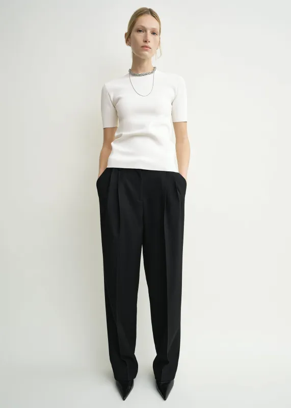 Double-pleat tailored trousers black sold by Toteme
