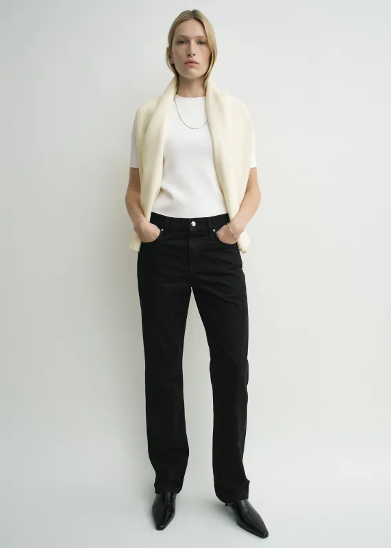Low straight denim black sold by Toteme
