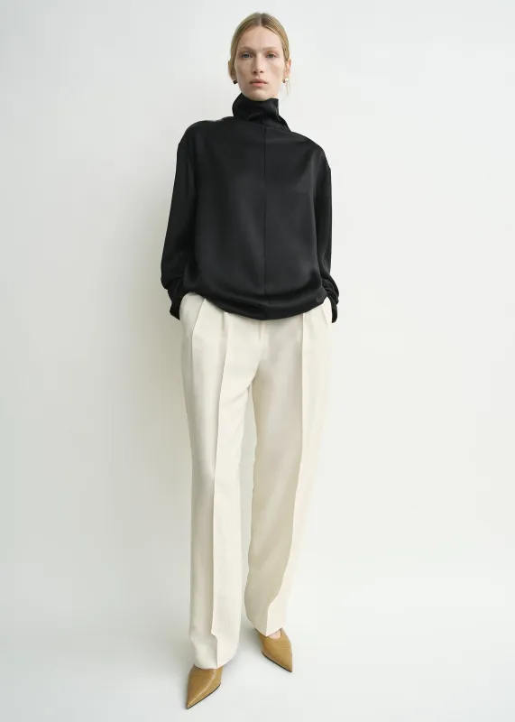 Slouch-neck blouse black sold by Toteme