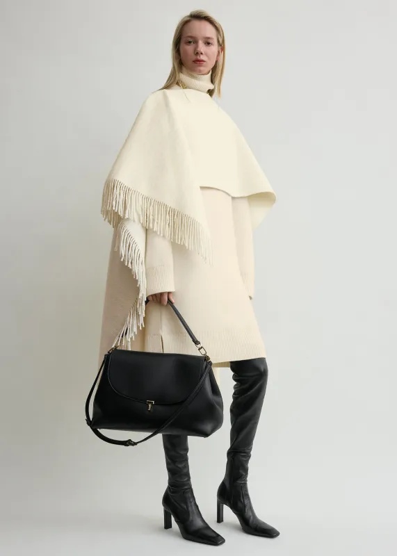 Fringed poncho winter white sold by Toteme