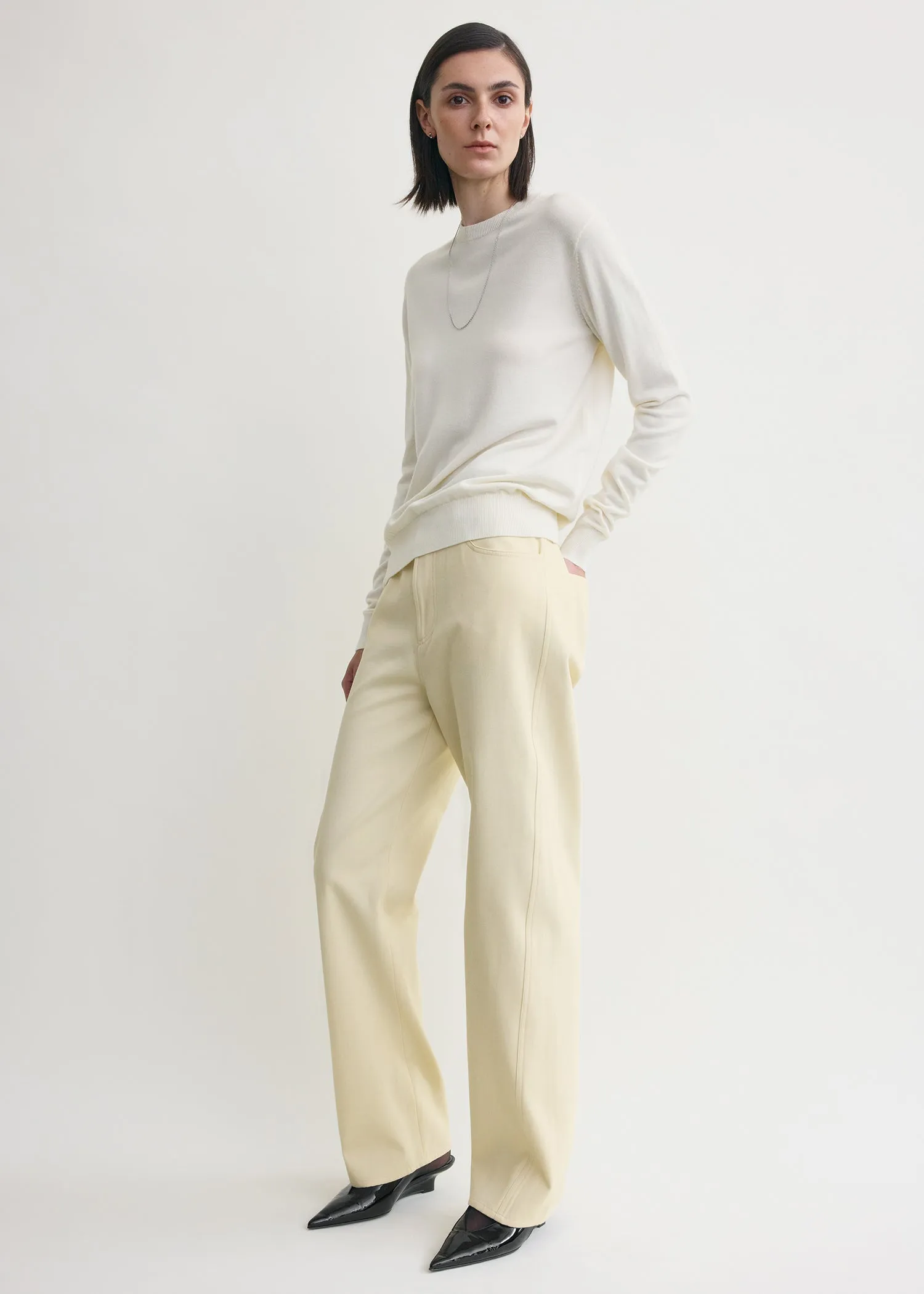 Relaxed twisted trousers sand sold by Toteme