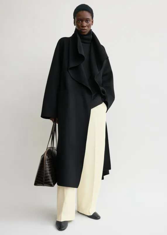 Signature doublé coat black sold by Toteme