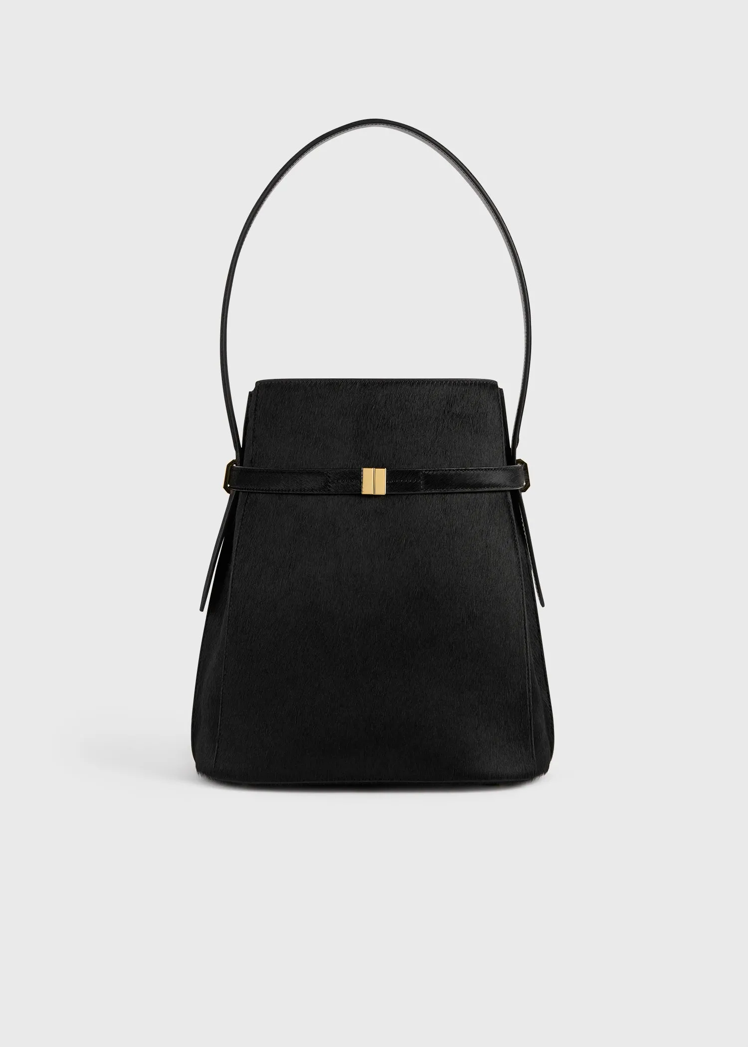 Belted pony hair bucket bag black sold by Toteme