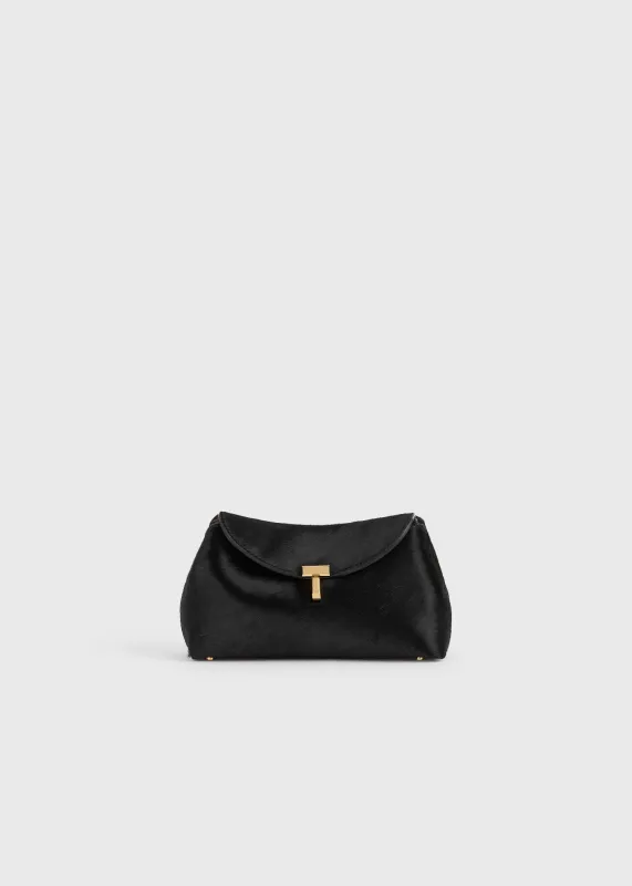 Mini T-lock pony hair clutch black sold by Toteme