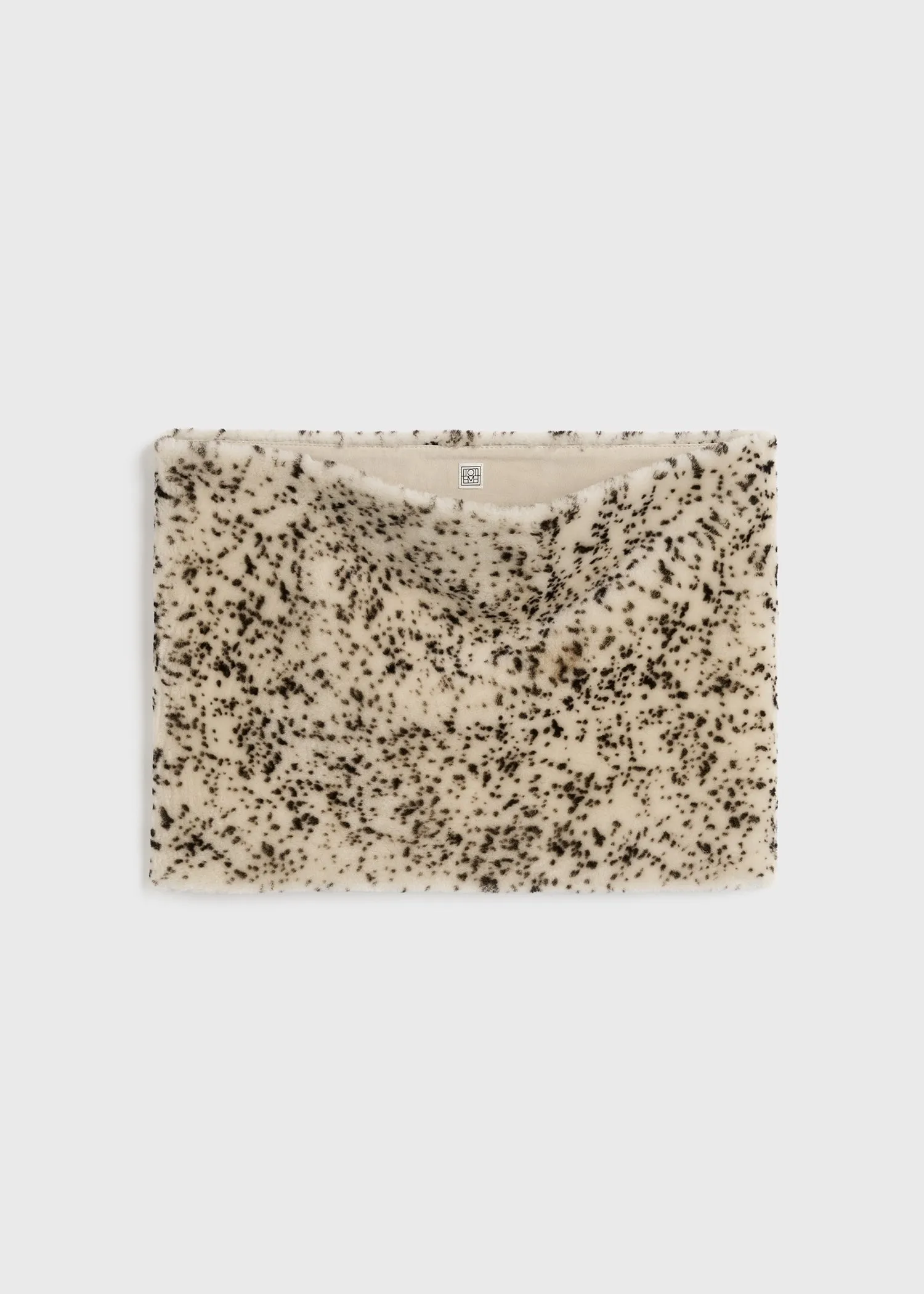 Stracciatella shearling muff black/white sold by Toteme