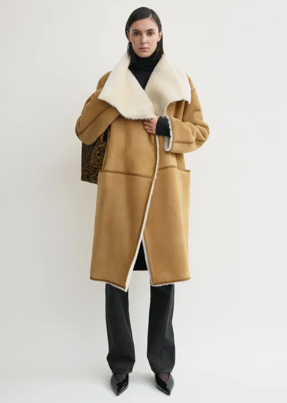 Draped shearling coat tan sold by Toteme