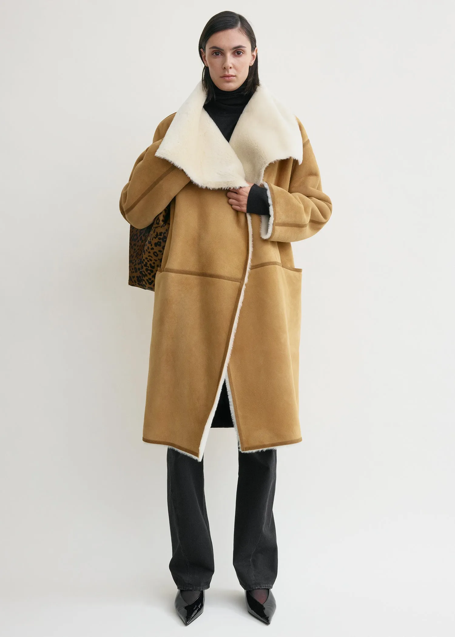 Draped shearling coat tan sold by Toteme