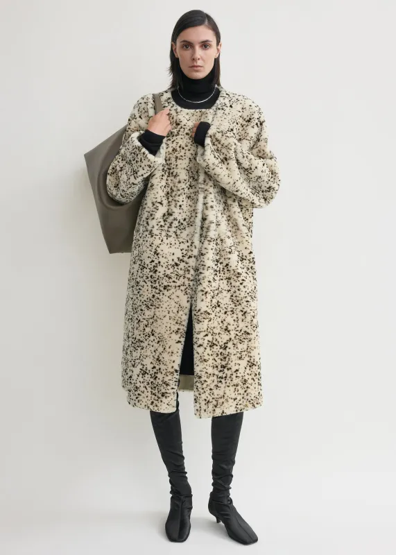 Stracciatella shearling coat black/white sold by Toteme