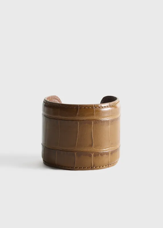 Croco-embossed cuff camel made by Toteme