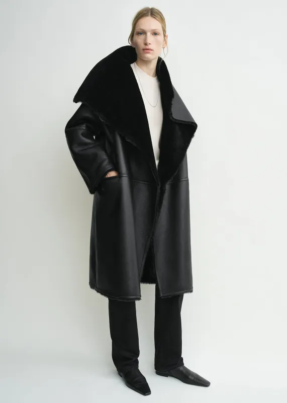 Shearling wrap coat black sold by Toteme