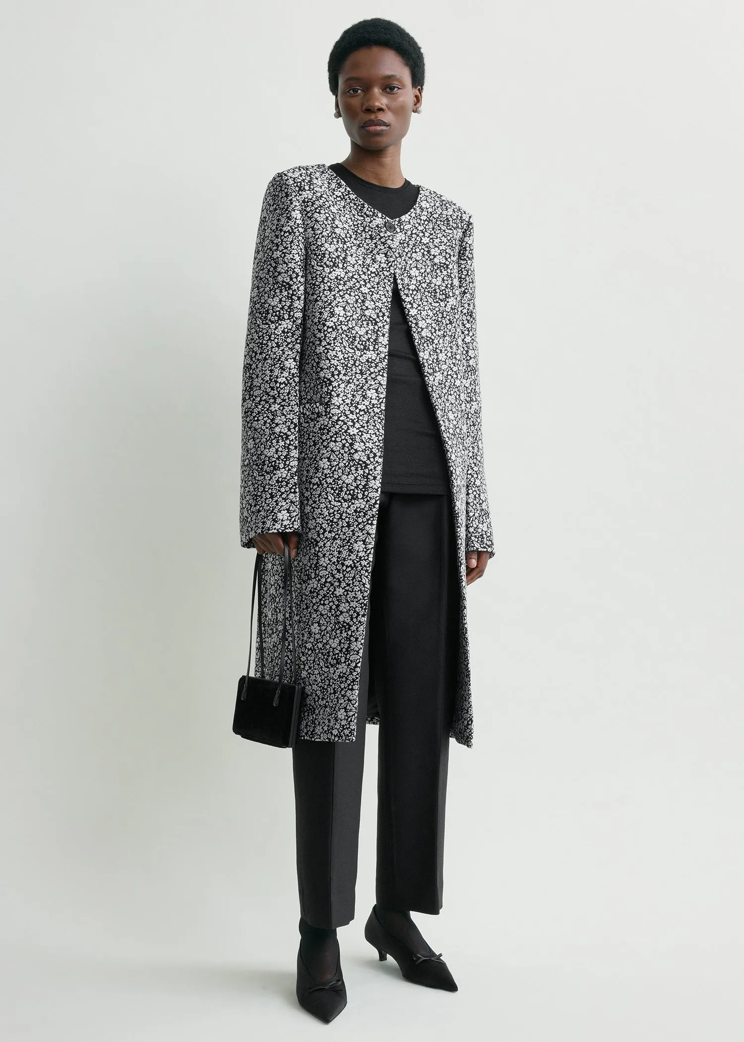 Collarless floral coat white/black sold by Toteme