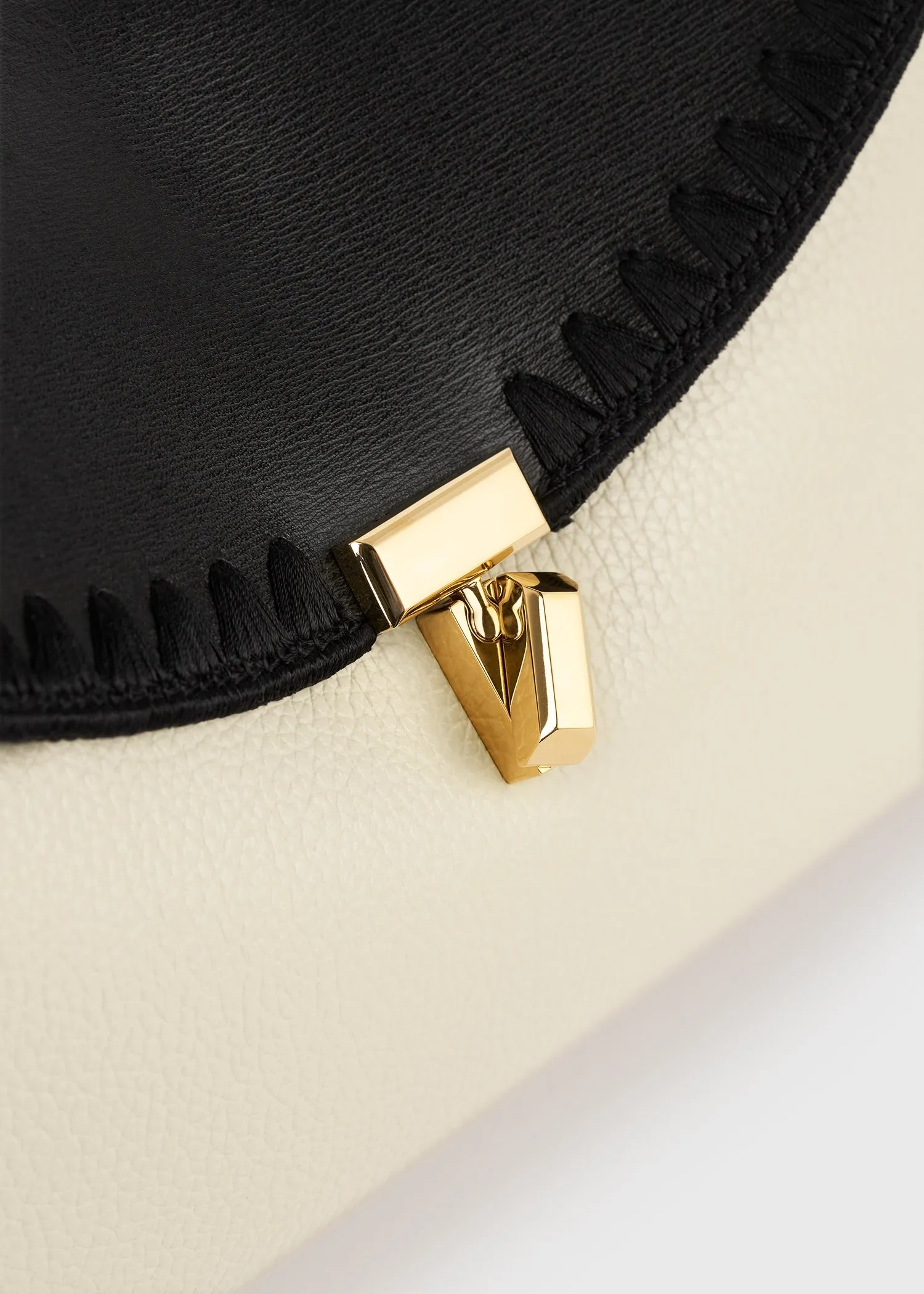 T-lock embroidered leather clutch black/milk sold by Toteme product image thumbnail 5