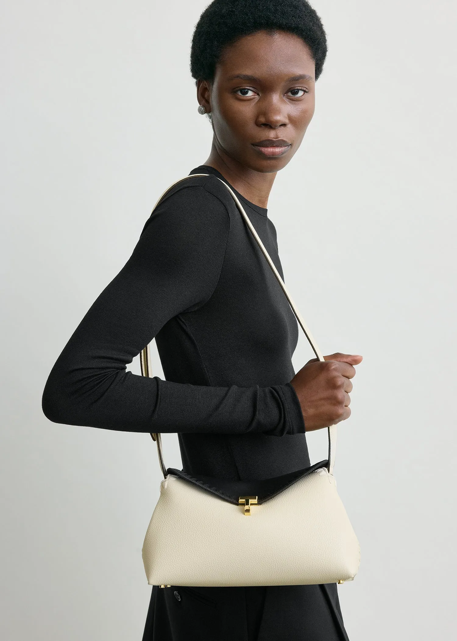 T-lock embroidered leather clutch black/milk sold by Toteme product image thumbnail 3