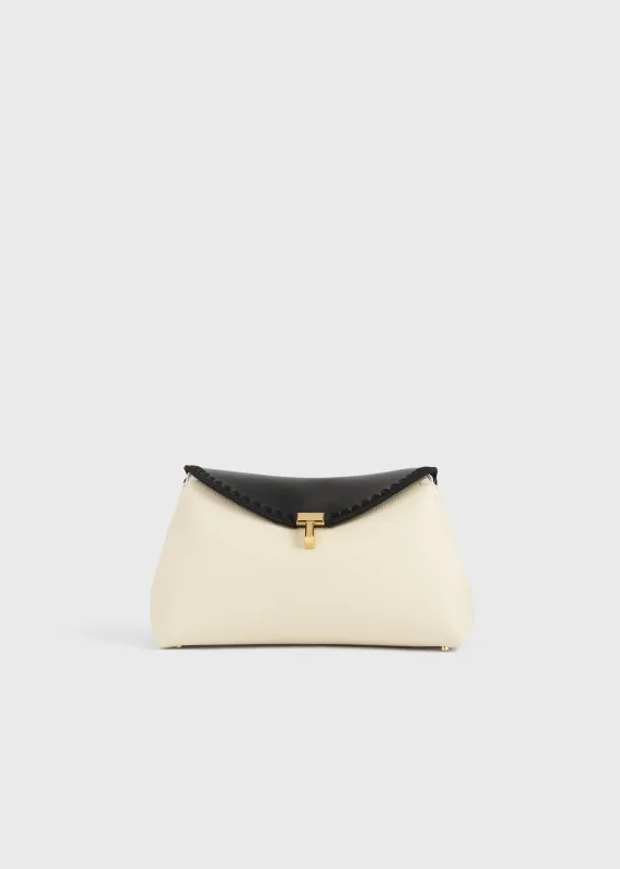 T-lock embroidered leather clutch black/milk made by Toteme