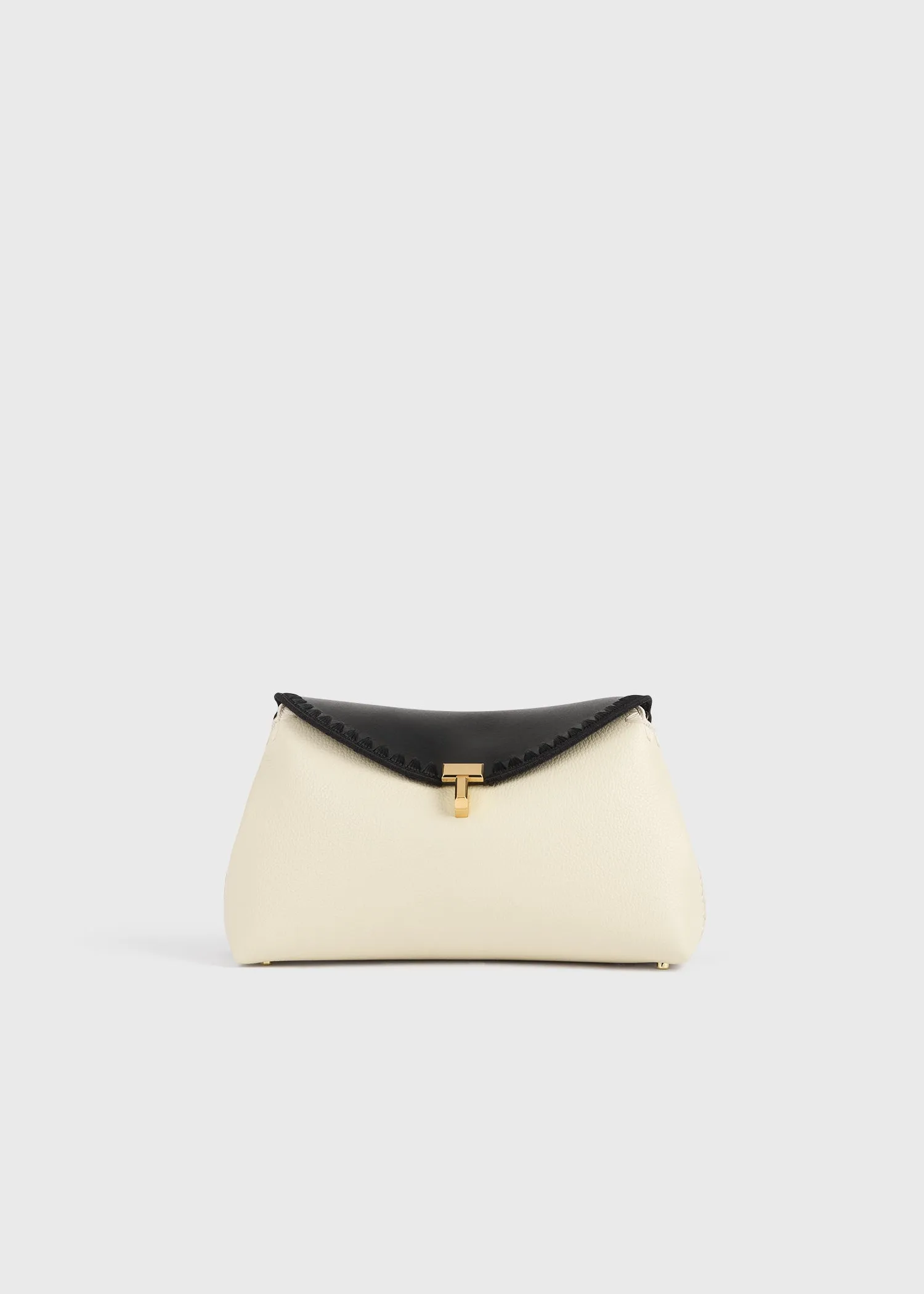 T-lock embroidered leather clutch black/milk sold by Toteme
