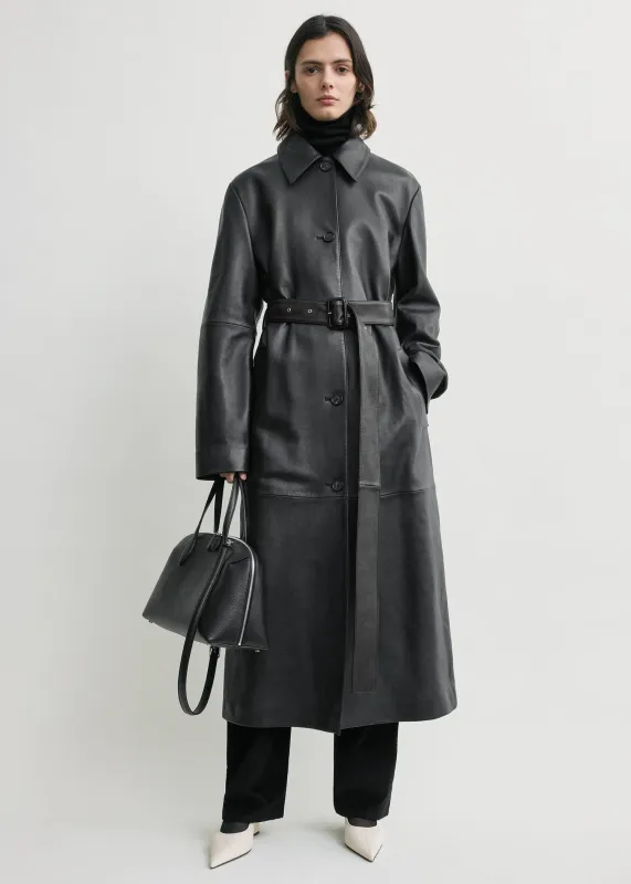 Belted leather coat black sold by Toteme