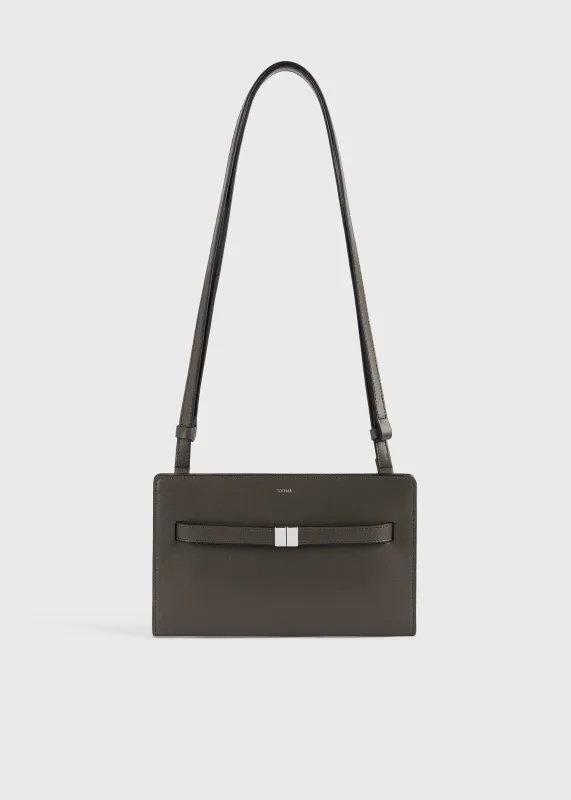 Belted leather crossbody bark sold by Toteme