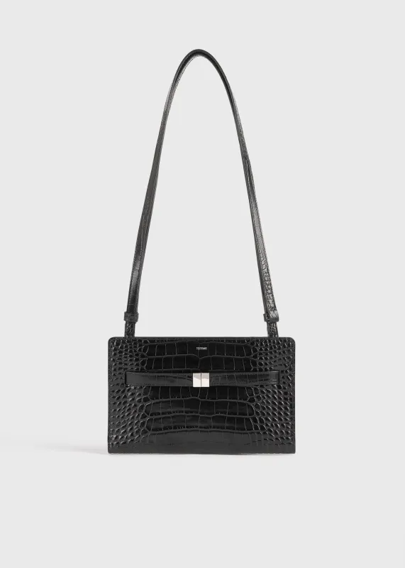 Belted croco-embossed crossbody black sold by Toteme