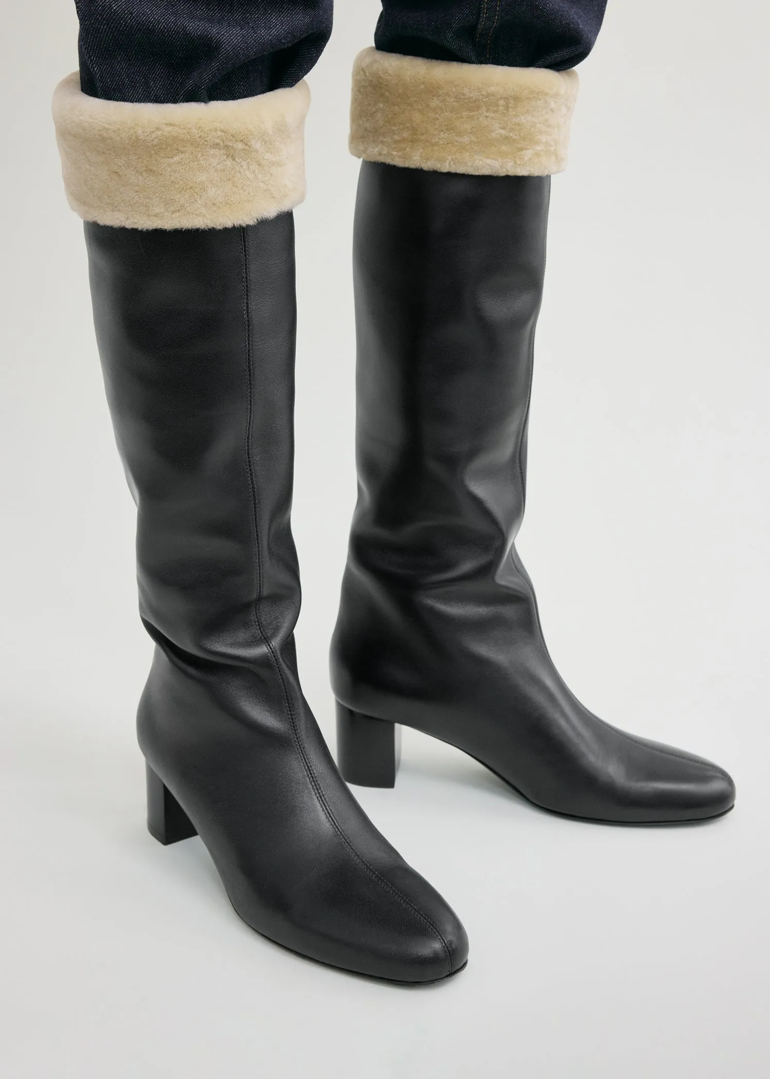 Downtown shearling knee-high boots black/beige sold by Toteme product image thumbnail 3