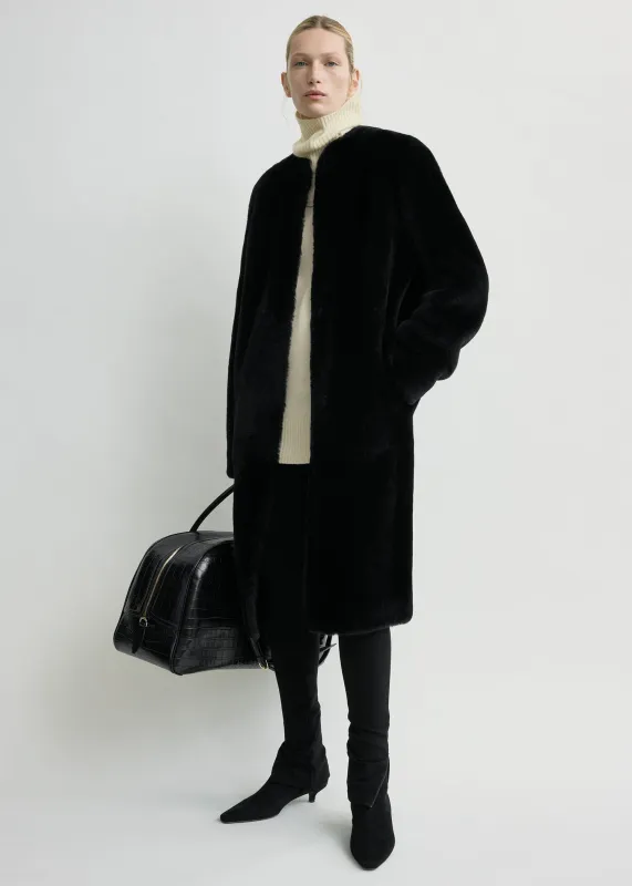 Shearling midi coat black sold by Toteme