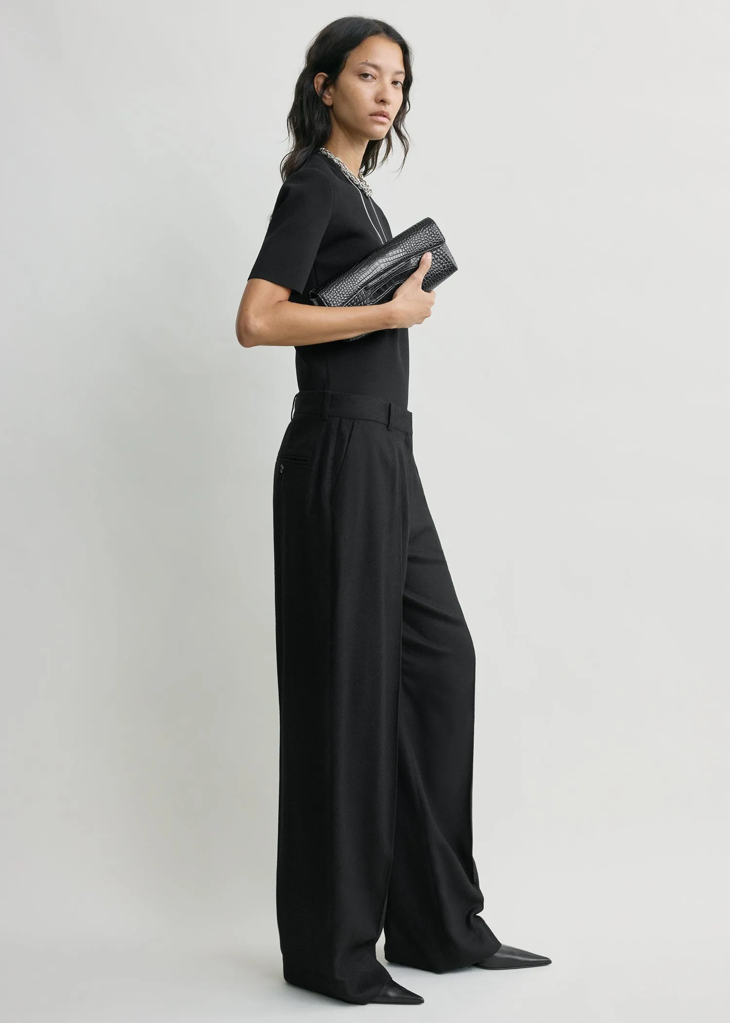 Wide flannel trousers black sold by Toteme