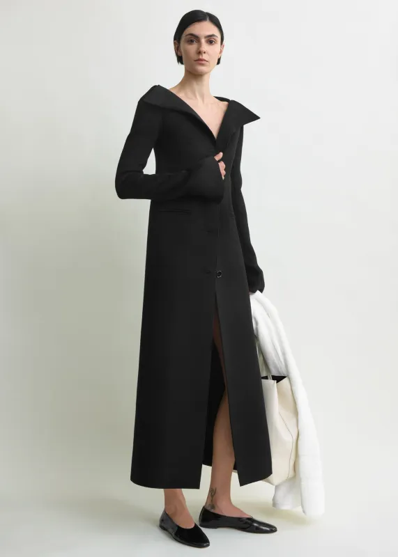 Open collar wool coat black sold by Toteme
